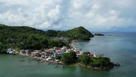 Remote-fisher-village-in-the-Philippines,-surrounded-by-rainforest-jungle