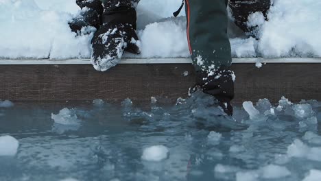 person touching ice and snow