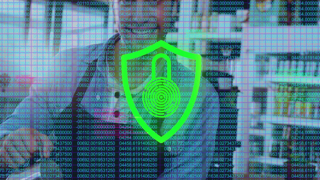 man presenting cybersecurity code to woman at desk, being overlaid with animated red shield icon