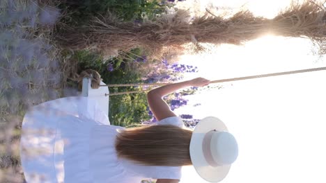 woman sitting on wooden swing overlooking scenic valley from cliffside viewpoint sur woman sitting on wooden swing overlooking scenic valley from cliffside viewpoint surrounded by trees mid swing nature leisure concept