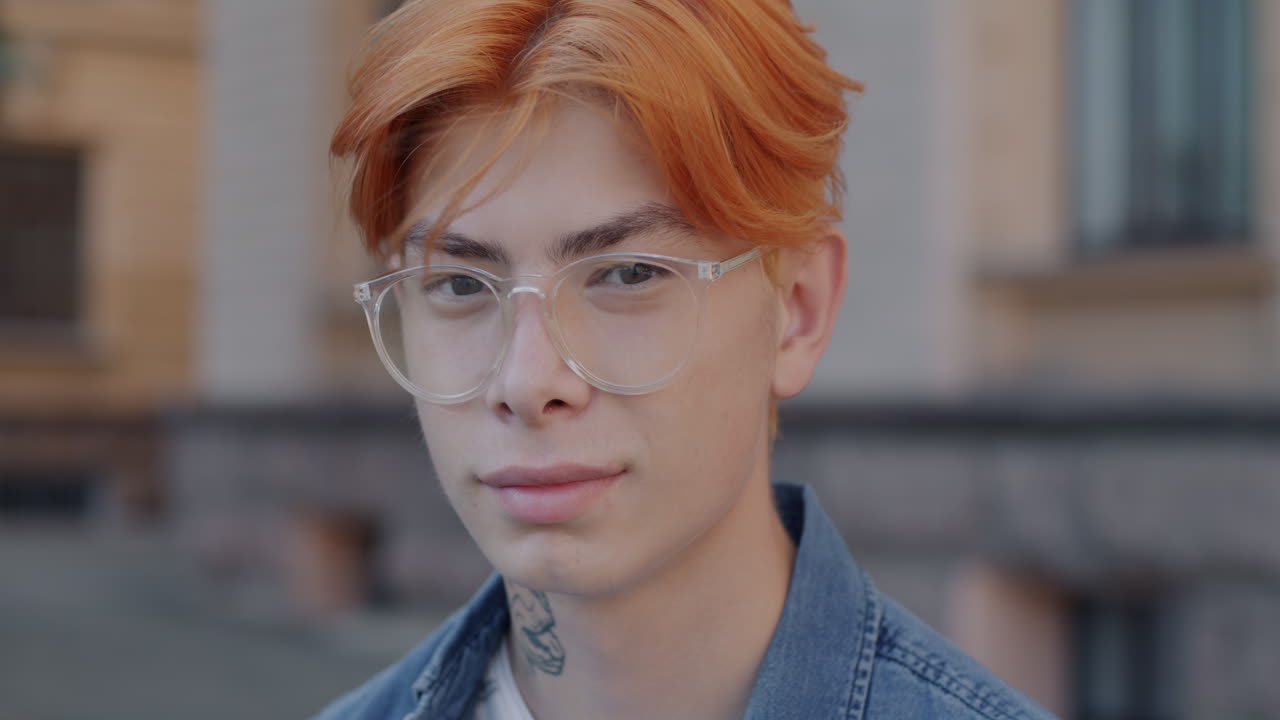 Young Man with Ginger Hair and Glasses