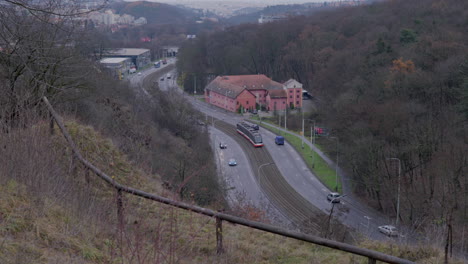 Prague-tramway-tracking-high-shot-to-a-city-reveal-on-a-cloudy-day