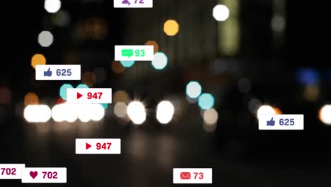 Animation-of-social-media-icons-and-numbers-over-out-of-focus-city-and-traffic-lights