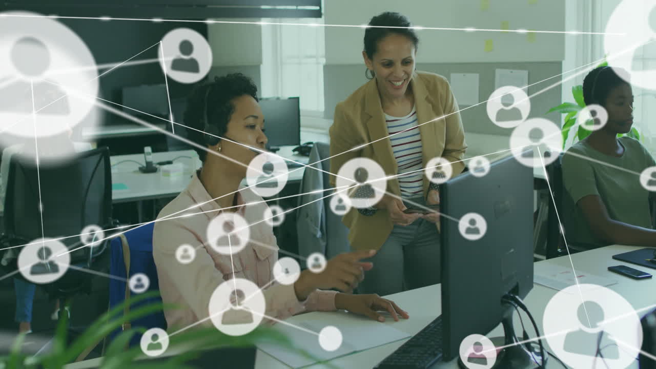 Collaborating at desk, business professionals with network connections animation overlay
