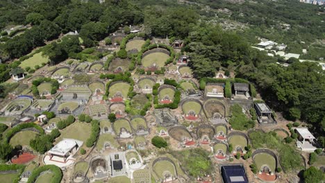 graves in a chinese cemetery, aerial tracking shot