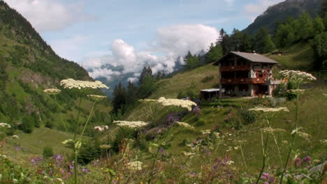 handheld rising shot of a swiss chalet