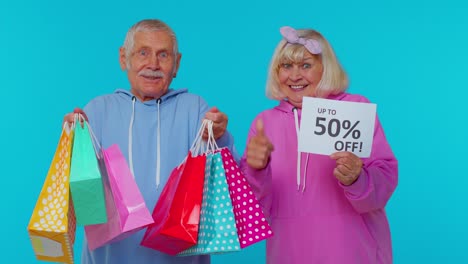 excited senior couple shopping with discount