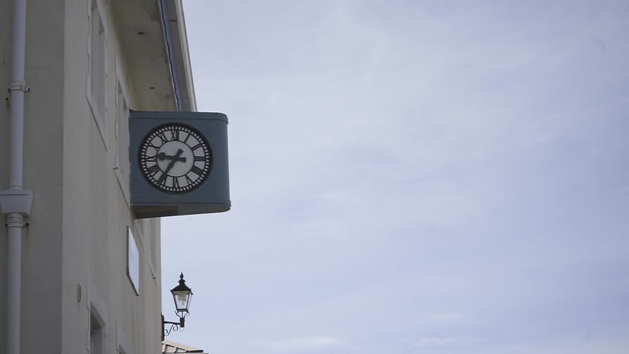 Vintage clock marking passage of time against architectural background, revealing urban landscape's timeless rhythm and heritage