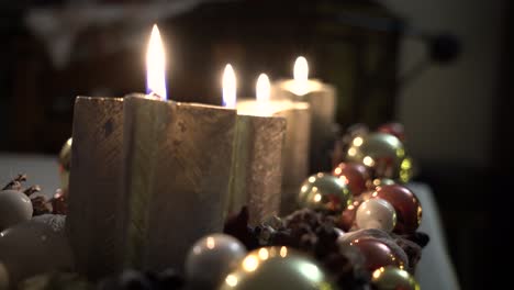 four flaming candles on an advent wreath at christmas eve recorded with a sony a7 iii in 4k 30fps