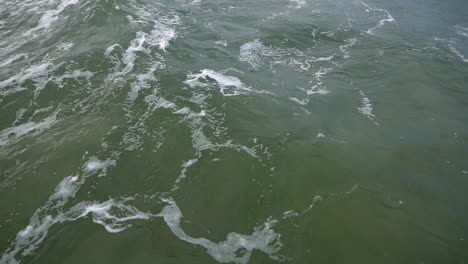 static shot of soothing waves on surface of baltic sea shot in slow motion