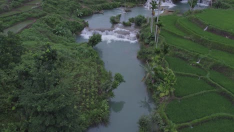 Drone-shot-of-the-Waikacura-Waterfalls-Sumba-Island-East-Indonesia,-aerial