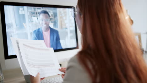 businesswoman on video call with colleague