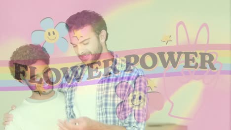 Animation-of-flower-power-text-with-rainbow-and-flowers-over-happy-male-gay-couple-embracing
