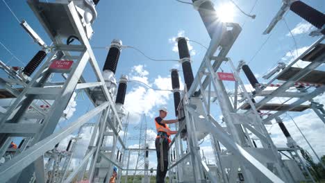electrical engineers inspect the electrical systems at the equipment control cabinet