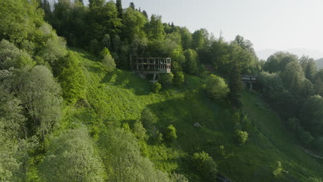 old and abandoned structures on dense forest mountains of bakuriani in georgia