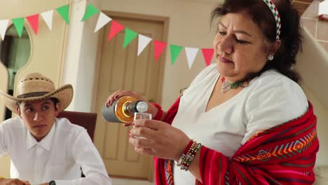 Mexican-woman-pouring-tequila