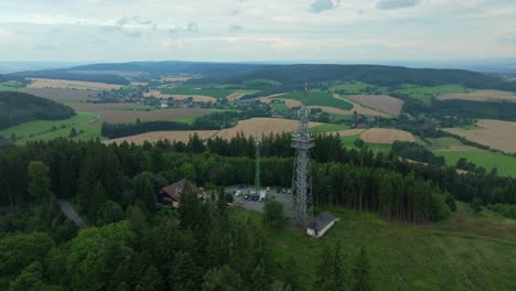 a view of the czech landscape from a drone. a transmitter and an observation tower providing a view of the surroundings