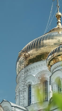 orthodox church exterior with lush green foliage