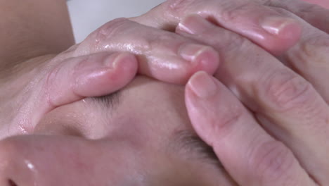 facial massage and ear close-up
