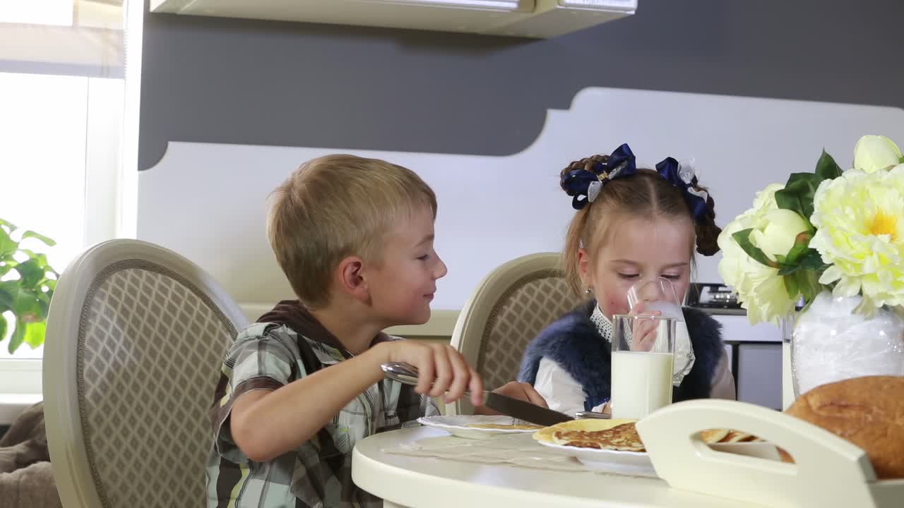 Family having breakfast at the table