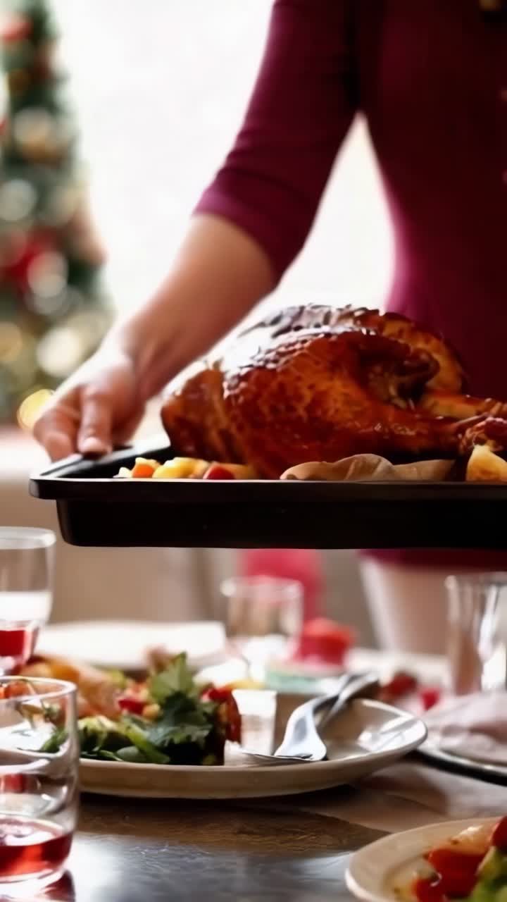 Close-up of a man's hands holding a tray with a beautifully roasted turkey. Thanksgiving dinner