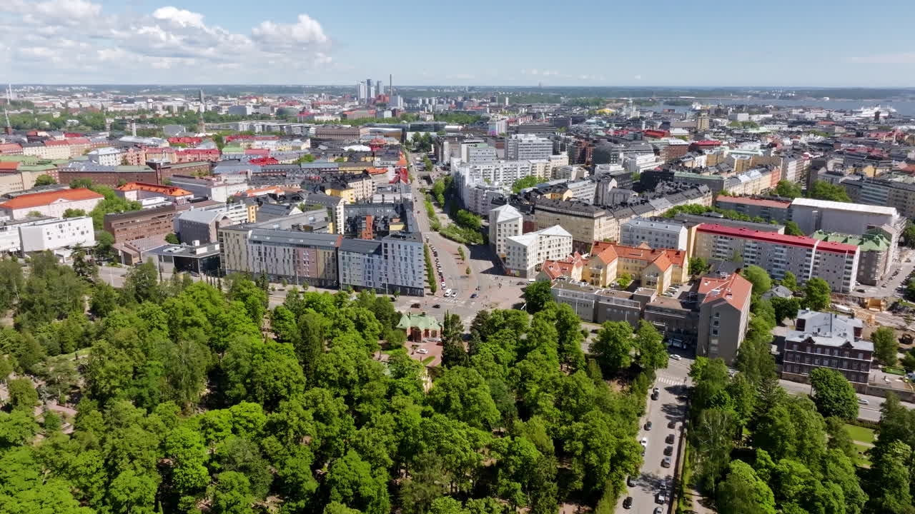 Aerial view of the Hietaniemi cementery and the Helsinki skyline, summer day