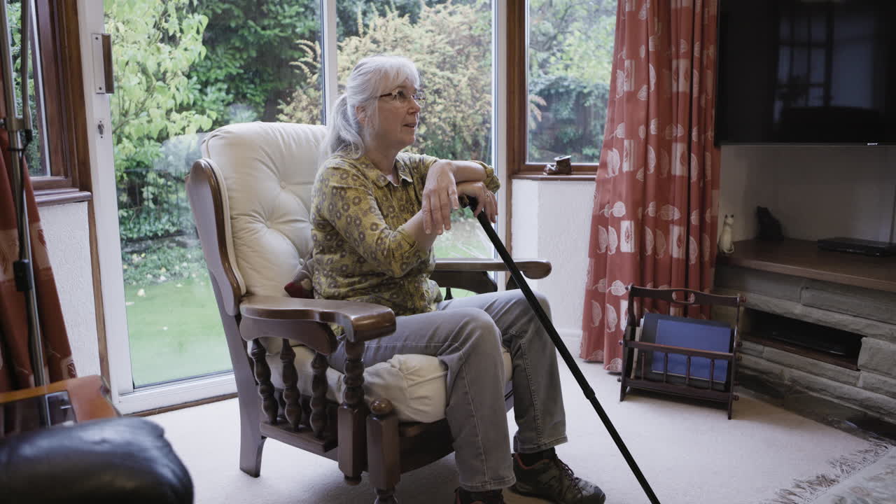 Elderly woman sitting in a chair