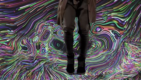 low section of caucasian woman dancing over multicoloured liquid swirl background