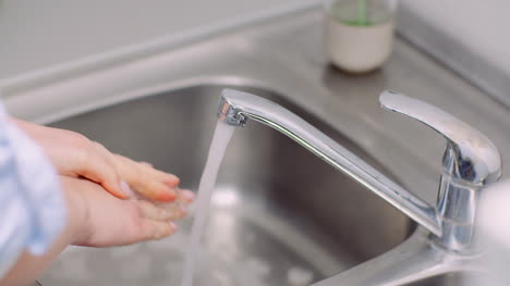 Washing-And-Disinfecting-Hands-In-Sink