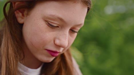 close-up portrait of a thoughtful teenage girl