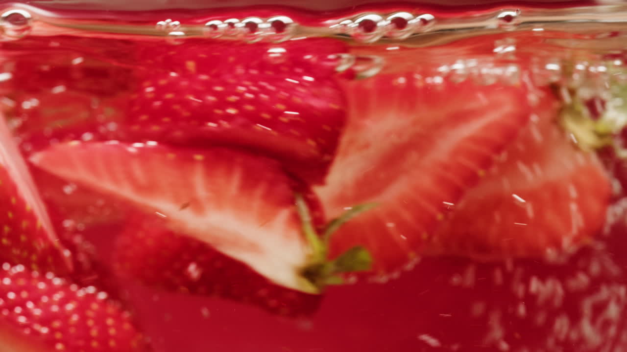 Fresh Strawberries in Water with Bubbles