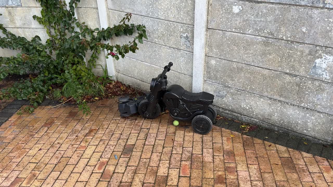 An old toy motorbike in a backlot in a suburban home in Cape Town.