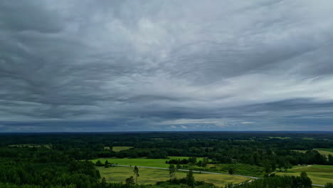 sea of clouds above lush rural nature landscape