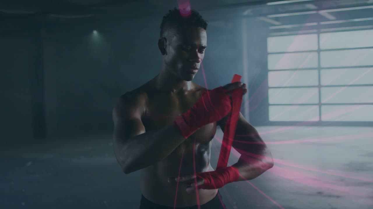 Atleta do sexo masculino pegando um envoltório vermelho e envolvendo as mãos na garagem enquanto faixas vermelhas animadas sinalizam a preparação para o boxe