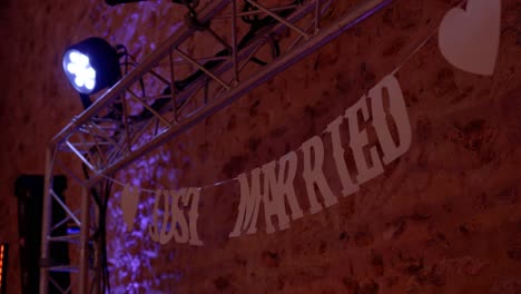 slow orbiting shot of just married bunting at a wedding venue