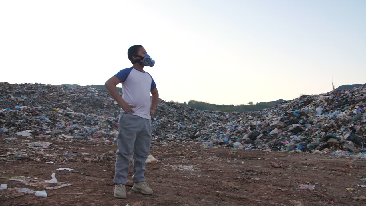 Asian Boy Wearing Pollution Mask Standing With Garbage Pile, Slow Motion