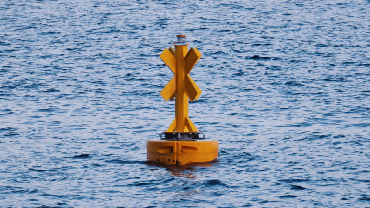 Special marker buoy floating on the surface of a calm sea