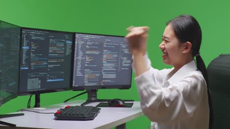 woman celebrating coding success