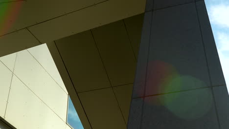 underneath view of modern architecture with a clear sky