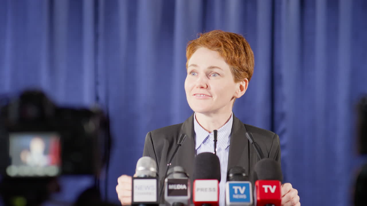 Female Politician Giving Speech on Live TV