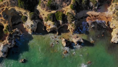 Drone-shot-of-the-cliffs-at-the-coast-in-Lagos,-Portugal