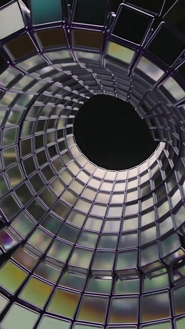 Video vertical: Cámara alejándose, baldosas espejadas formando una espiral en un vacío oscuro, centrándose en el núcleo.
