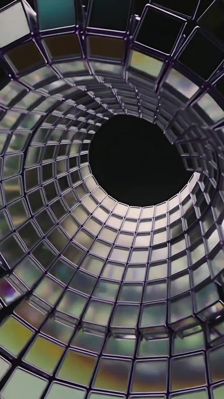 Video vertical: Cámara alejándose, baldosas espejadas formando una espiral en un vacío oscuro, centrándose en el núcleo.