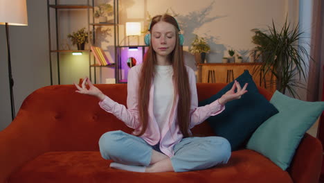 Girl-breathes-deeply-with-mudra-gesture,-eyes-closed,-meditating-with-concentrated-thoughts-peaceful