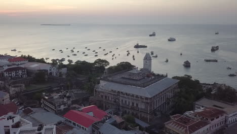 Aerial-orbits-the-Old-Fort-and-Palace-Museum-in-Stone-Town,-Zanzibar