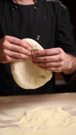 chef preparing pizza dough