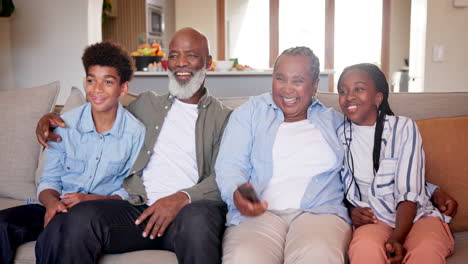 multigenerational family watching tv