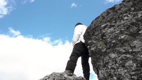 man standing on a mountain top