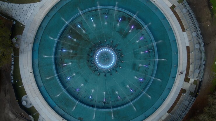 Top down aerial footage that flies out to reveal a wide of the Friendship Fountain in Jacksonville, Florida