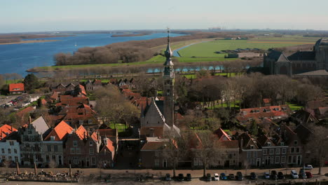 aerial: the historical town of veere with an old harbour and churches, on a spring day